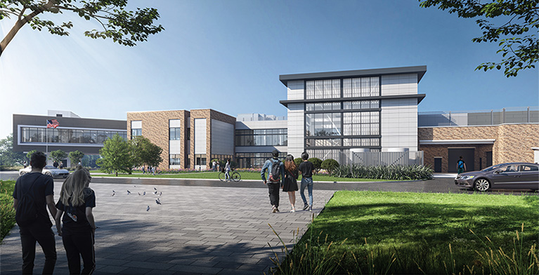 People walking toward a modern-looking building